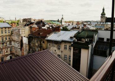 cathedral surrounded by houses during daytime