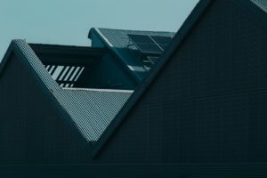 the roof of a building with a clock on it